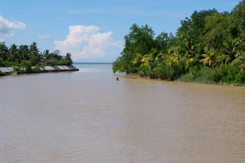 Murky Hijo river waters with Davao gulf in the back