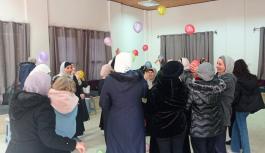 Palestinian women participate of a game with ropes in a psychosocial support session in Hebron.