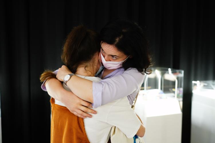 Visitors hugging each other