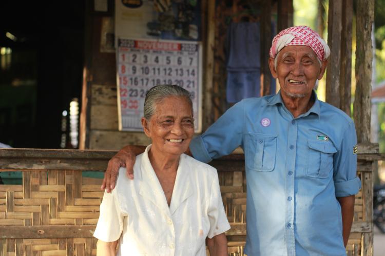 Community members in front of a house