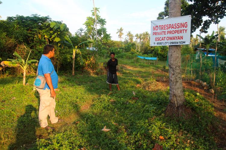 Ustadh Akmad with no trespassing sign