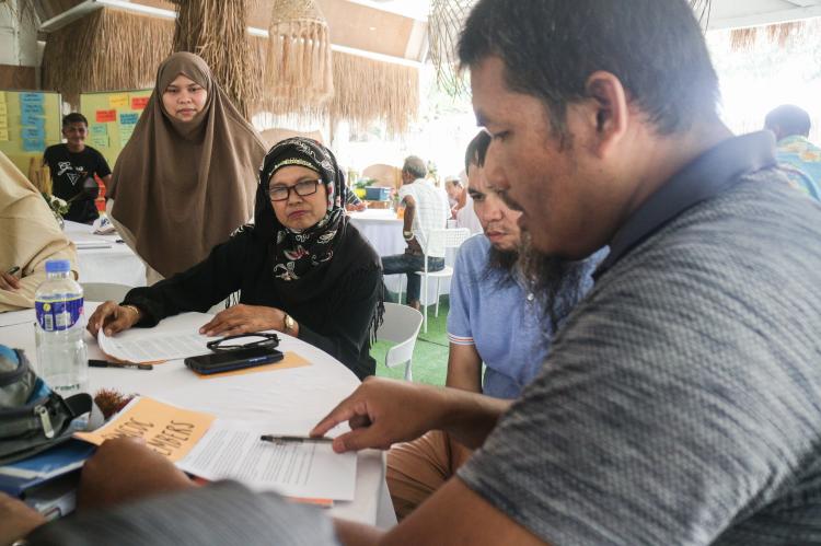Ustadh Akmad during role play prep