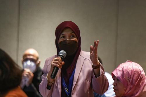 Participant raises question to panel