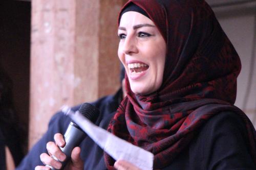 Women speaking at exhibition opening