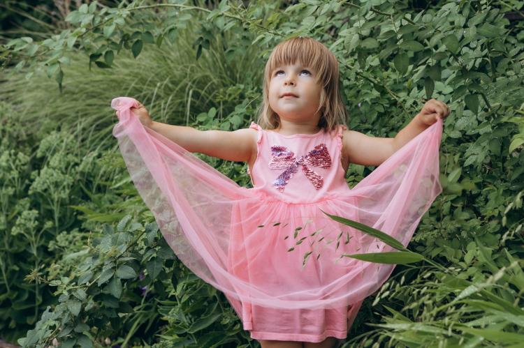 A young participant stands outdoors during the Kid Friendly Summer Lab in Odesa, Ukraine.