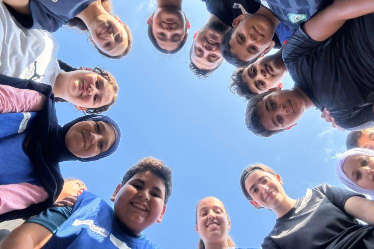 Kids in a circle view from below