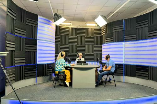 Representatives of the project participate in a radio interview discussing the Point of Support project in a recording studio in Chernivtsi, Ukraine.