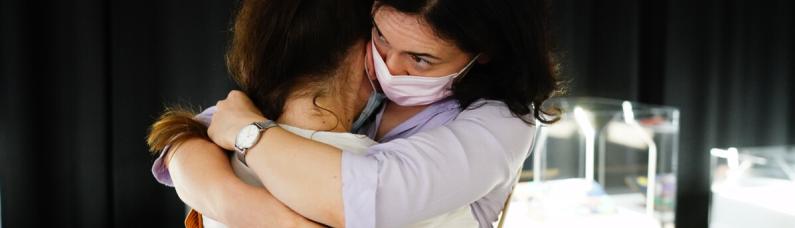 Trauma work in Ukraine Embrace of two women in Ukraine