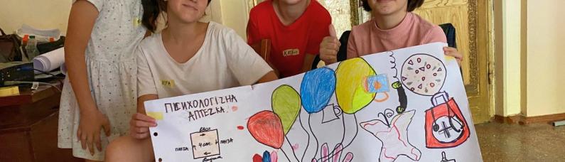Empathy makes school Children in Ukraine hold up a poster they designed