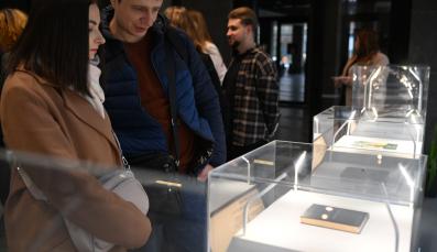 Visitors exploring the exhibition &ldquo;Books That Accompany Through War&rdquo; and its displays