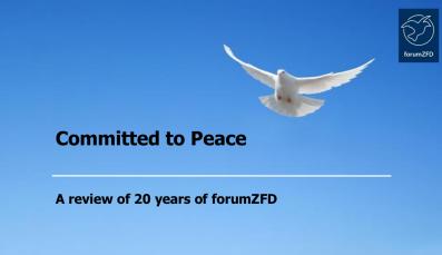 A white peace dove is flying in a blue sky