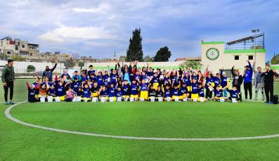 Sports for Peace group photo with coaches and children during the closing ceremony