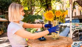 Girl arranging sunflowers in Odesa