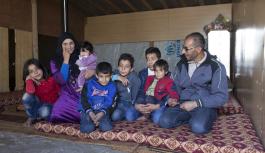 Community Activist sitting with his family
